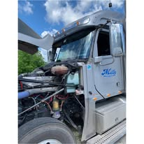 Large truck cab under blue sky