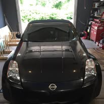 Black Nissan sports car in garage