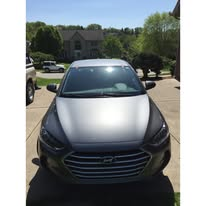 Dark sedan in a driveway